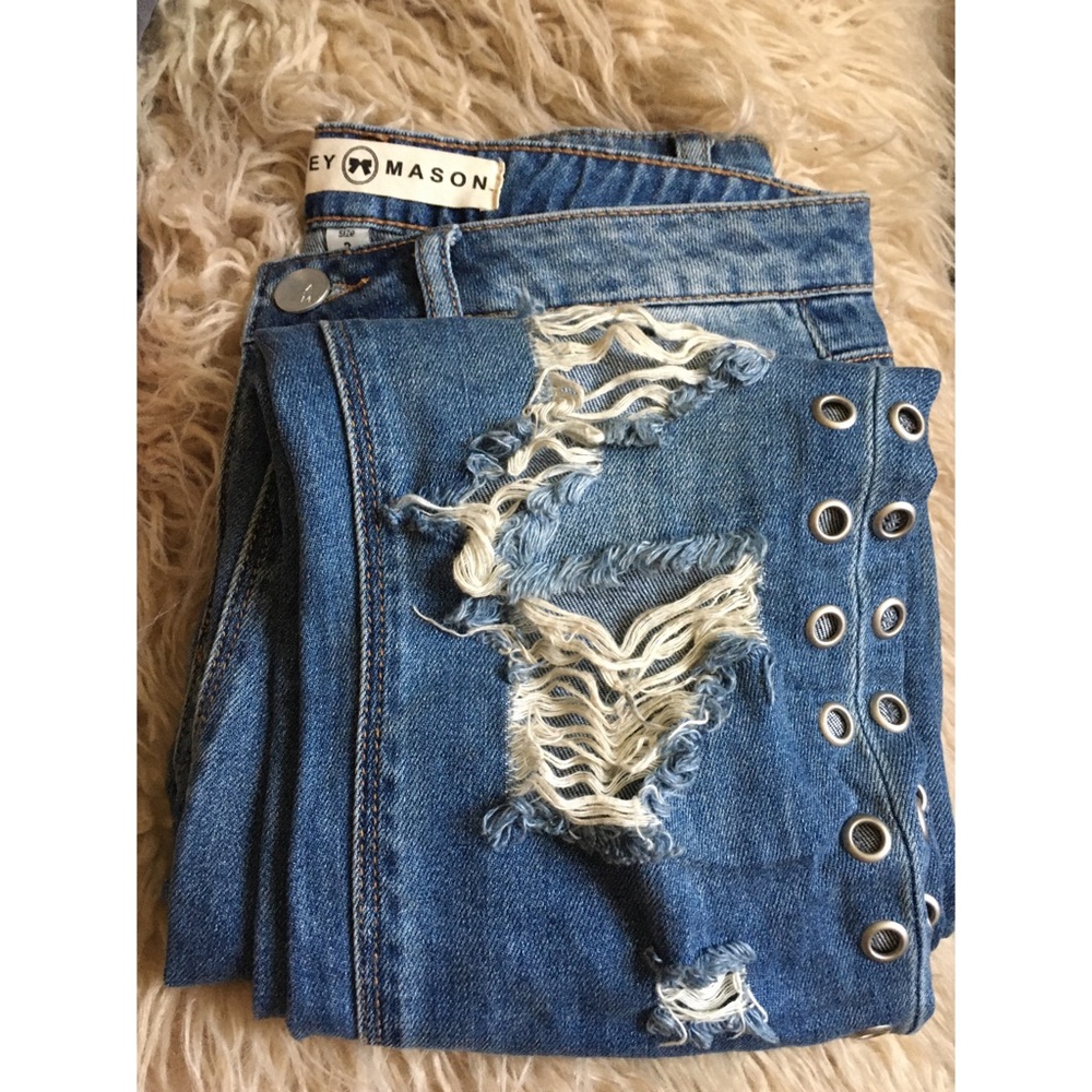 Ashley Mason destructed grommet jeans